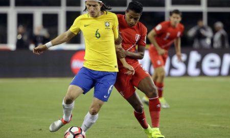 Brazil's Filipe Luis (6) and Peru's Andy Polo (8) contend for the ball during the first half of a Copa America Group B soccer match on Sunday, June 12, 2016, in Foxborough, Mass. (AP Photo/Steven Senne)